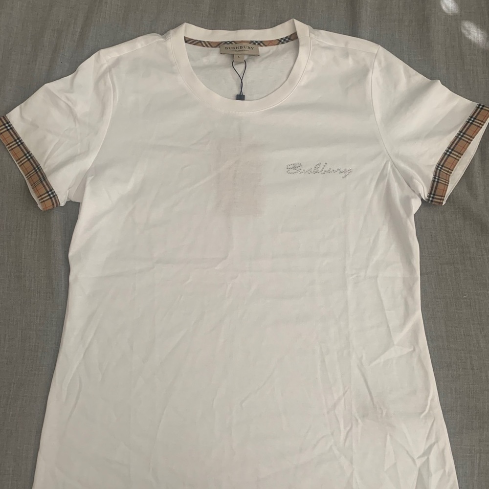 Super cute white bling bushberry/burberry shirt